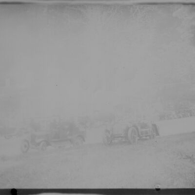 Bedford Village, view from green showing cars parked along side of green