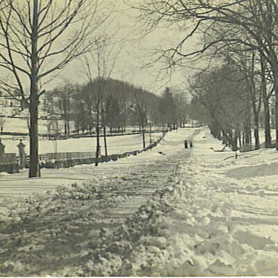 Pound Ridge Road in snow looking away from Village Green, Indian Hill on Left