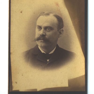 unidentified mustachioed man