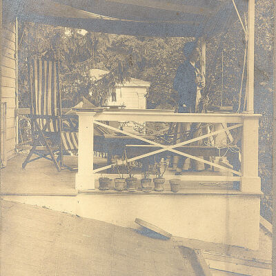 Portrait of unknown woman on a porch