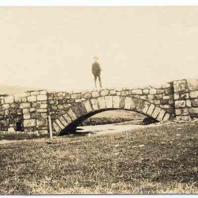 Postcard of boy on bridge
