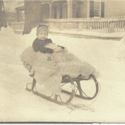 unidentified child in carriage on snowy Pound Ridge Road