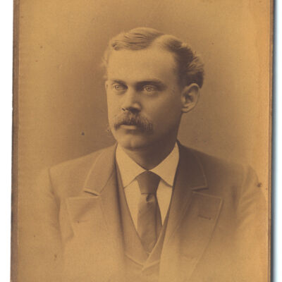 unidentified mustachioed man