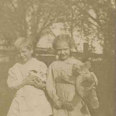 "Bo" Holtschneider on the left with his sister (?) holding a teddy bear. ca. 1912