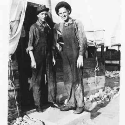 "Texas TwoBit and Sonicana Slim" in front of Co. M's home, August 15, 1918