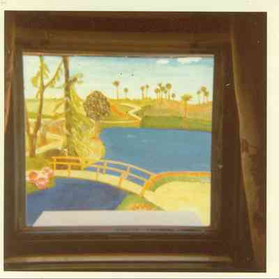 "Oil painting on building as seen through window.