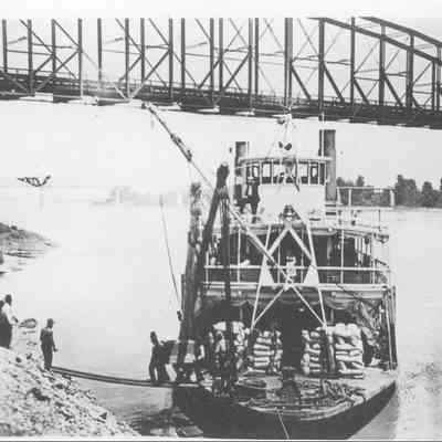 "Chester" Unloading Freight with Bridge in Background