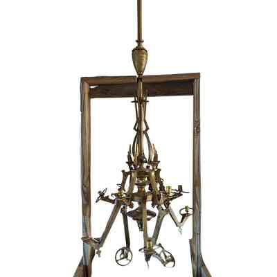 Chandelier is stored in a wooden support frame.