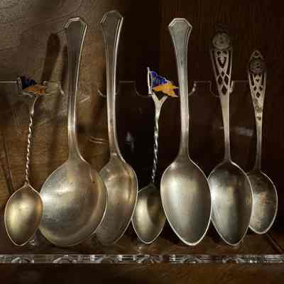 Set of seven silver antique Wheaton College spoons