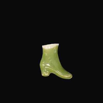 Green Ceramic Shoe from a Baby Doll