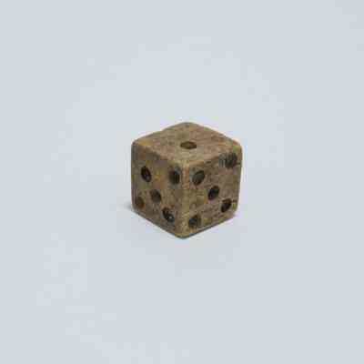 "Trick die" showing two sides of 5 and one side of 1