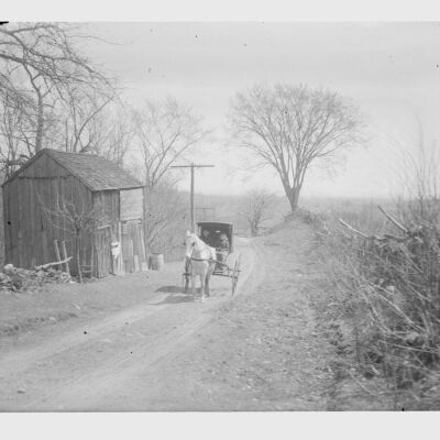 Man, Woman, Child in Buggy