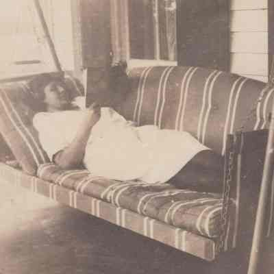 Woman on a porch swing