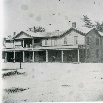 Red Hook Hotel with people on porches