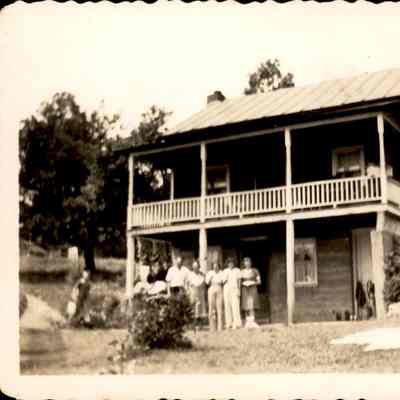 Riddleburgh House on Norton Road with family outside