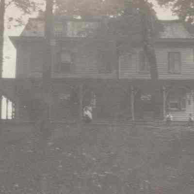 Rose Hill farmhouse with people on front porch