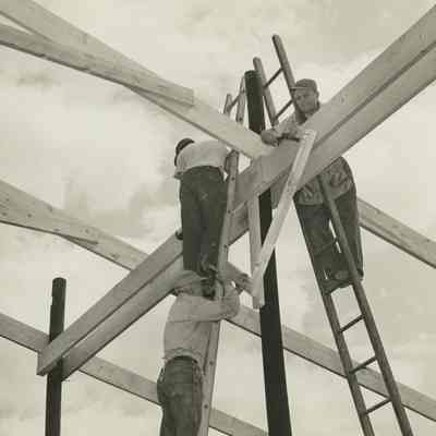 Thomson barn raising with Peter Bulkeley helping out, 1954