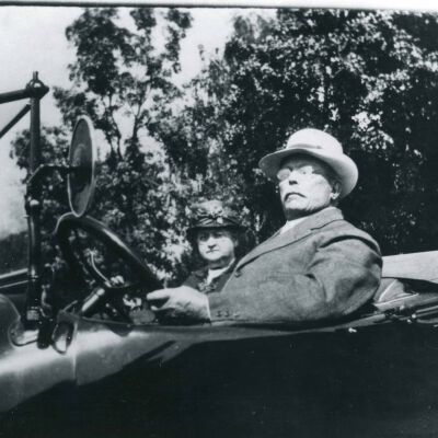 Henry Weaver and wife, Alice Coon, in convertible automobile