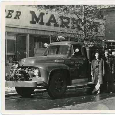 Red Hook Fire Department firemen posing in front of truck