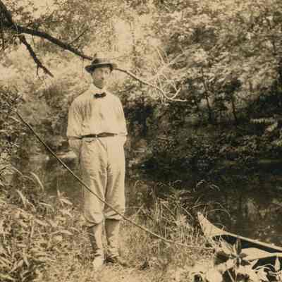 Frank Teal standing by stream