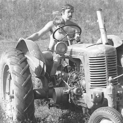 Woody Nicholas Klose and son Peter on tractor, c.1973