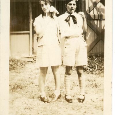 Two campers posing. "The School House" Midge & I 1929