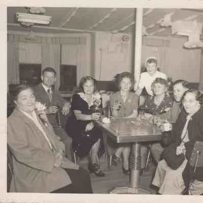 Group of people seated in a restaurant.