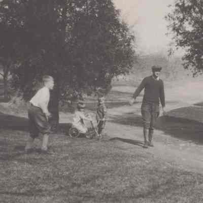 Gordon Mead outdoors with children,1928