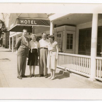 Howard and Olive Laib with two other people in front of Red Hook Hotel