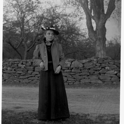 Nena Teator in front of stone wall