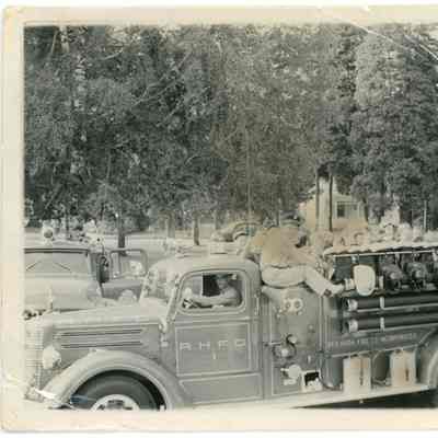 Schoolchildren riding Red Hook Fire Department truck.