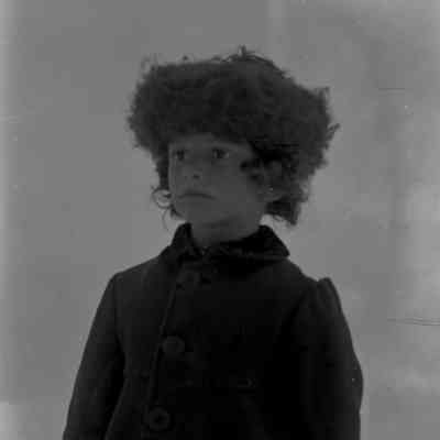 Child with large furry hat