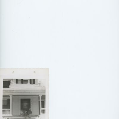 Iraca sisters with dog sitting on steps of 59 West Market St. c 1960