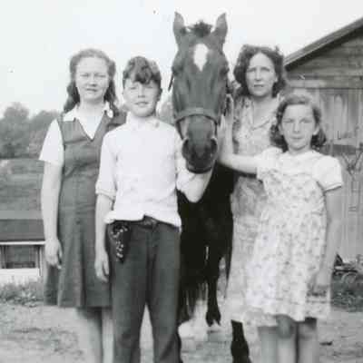 M. Doty as a young girl with horse