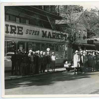 Red Hook Fire Department firemen in front of Empire Super Market