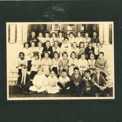 Third and fourth grade students sitting in front of Red Hook School #4