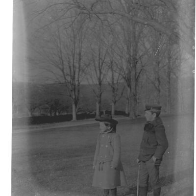 Roscoe & Marion Teator with tree-lined road in the background