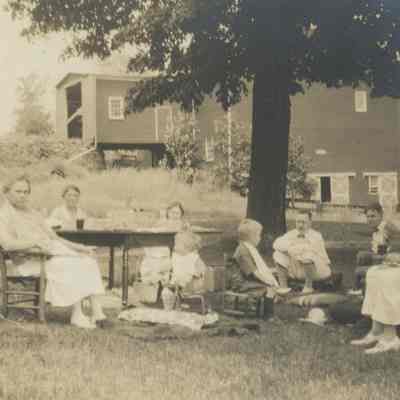Mead family seated outside, c 1925