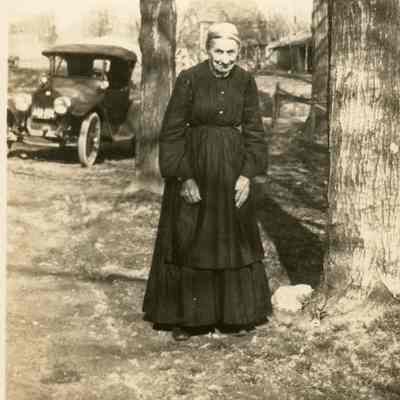 Grandma Decker standing in yard