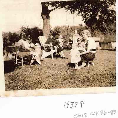 Riddleburgh family, seated outdoors, 1937