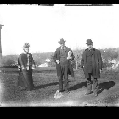 Unidentified Two Men and a Woman Standing