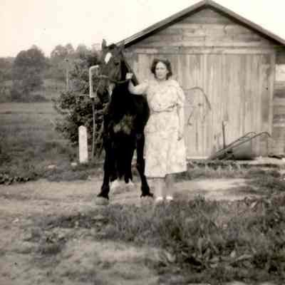 Unidentified woman with horse