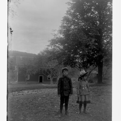 Roscoe & Marion Teator in front of a house, 1907