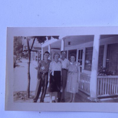 Howard and Olive Laib with two other people in front of Red Hook Hotel.
