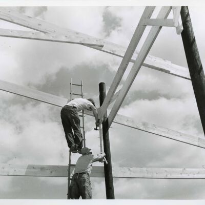 Workers hammering side support