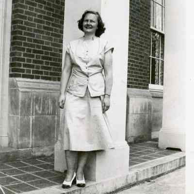 M. Doty poses in front of Red Hook Central School, 1949.