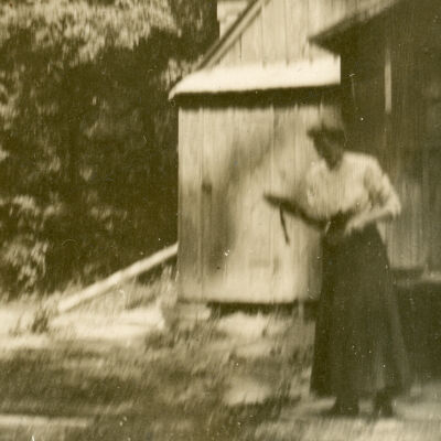 Women standing outside a building, Clermont