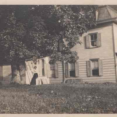 Woman on a swing outside Rose Hill farmhouse