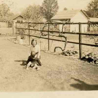 Dorothea Delamater in backyard with brother Edward