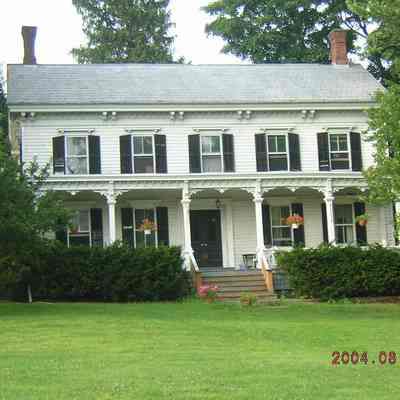 House at 8010 Albany Post Road. Stone building behind this house.
